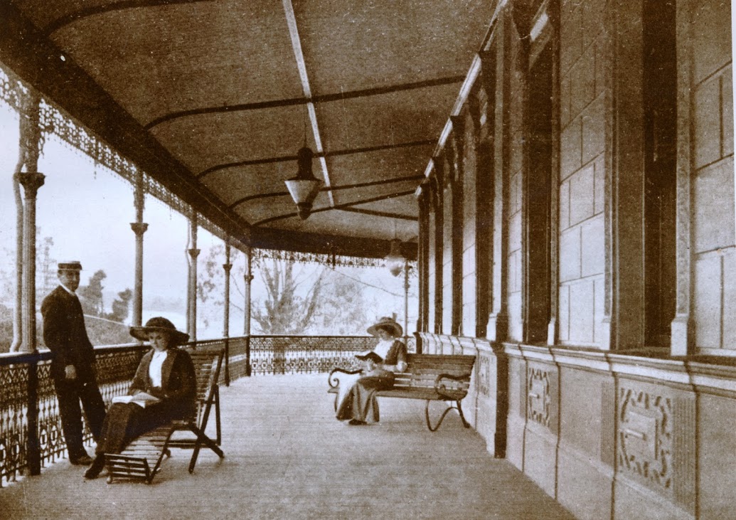 Midland Hotel guests reading on the balcony.